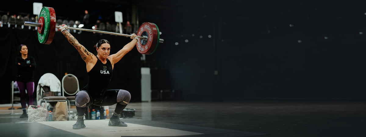 Athlete lifting a barbell in a weightlifting competition