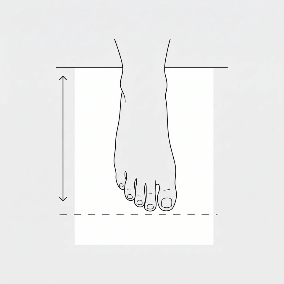 Top view of foot on piece of paper. Heel at the edge of the paper. Line mark at the toe.